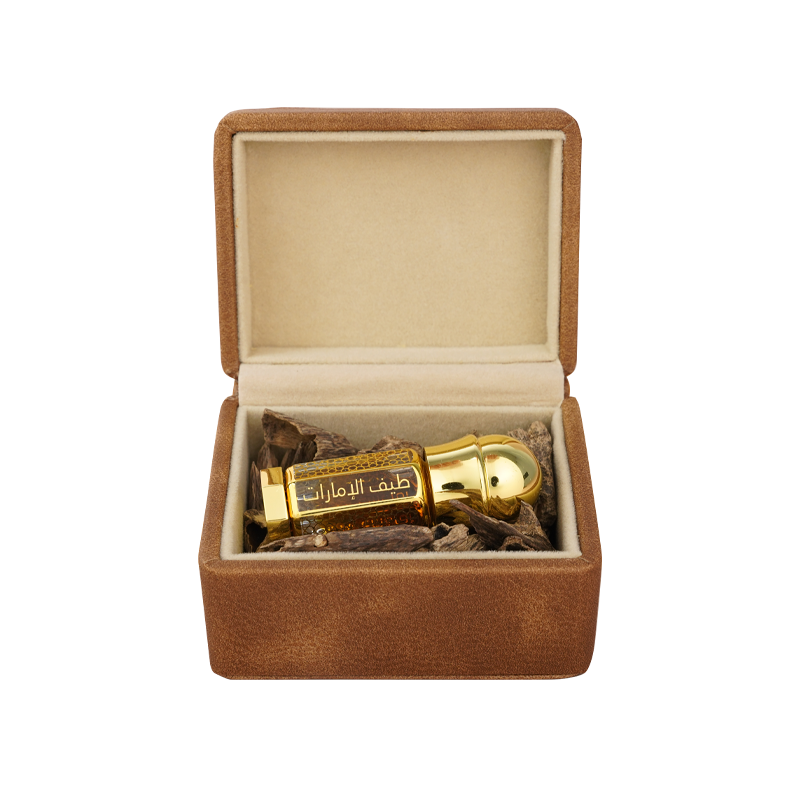 Dehn Oud With Oud oriental oil bottle 3ml cushioned amid wood chips in a luxury box - dehn al oud perfume in dubai