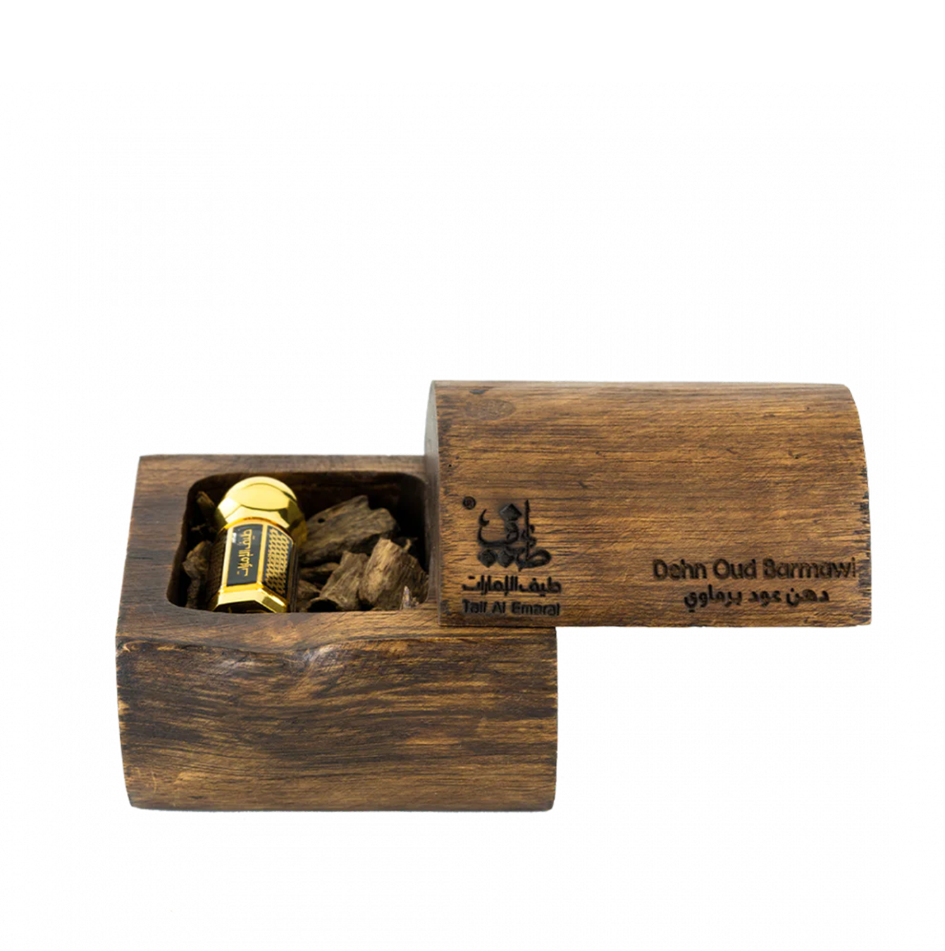 Dehn Oud Barmawi oriental oil bottle 3ml resting among oud wood chips - dehn al oud in dubai