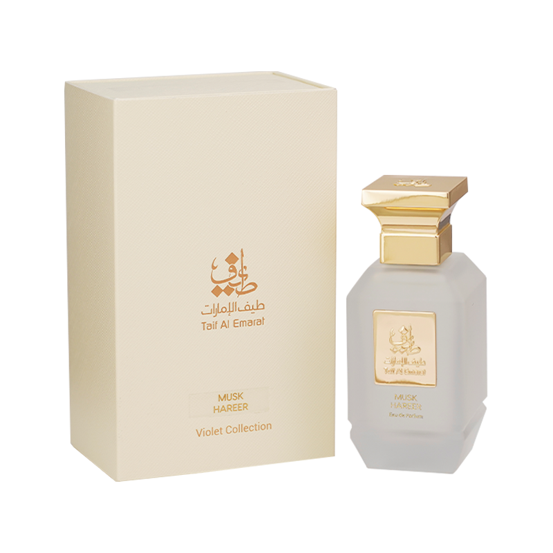 Musk Hareer women's perfume bottle 75ml standing beside cream elegant perfume box embossed with taif al emarat logo in golden color - peony perfume