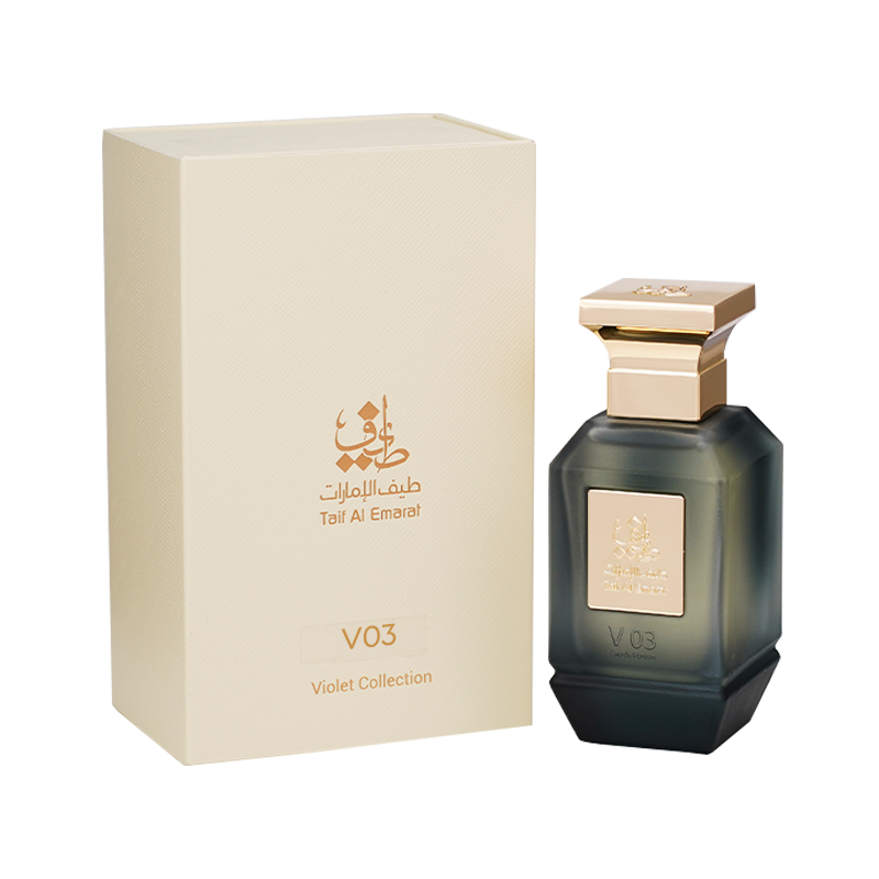 زجاجة عطر V03 النسائي 75 مل بجانب علبة كريمية فاخرة بشعار طيف الامارات الذهبي - عطر حريمي