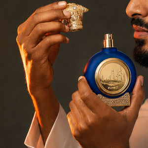 man hands holding Kuwait unisex perfume bottle 75ml from taif al emarat perfumes - best oud fragrances