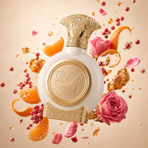 EMIRATES LAND men's perfume bottle 75ml surrounded by mandarins, roses, and pink peppercorn - greatest men's fragrances of all time