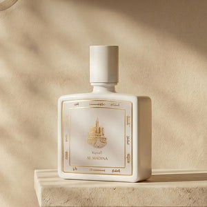 Al Madina perfume bottle 80ml from taif al emarat perfumes, on marble ledge with shadows - luxurious madina fragrance