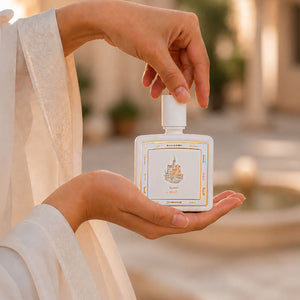 Hands cradling Mezab perfume bottle 80ml from taif al emarat perfumes - powerful leather oud perfume