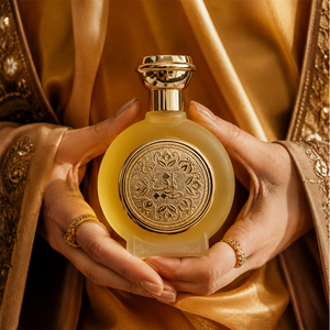 Hands in gold fabric cradling TAIF 04 unisex perfume bottle 75ml, best selling perfumes
