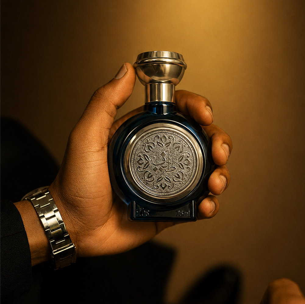 Hand holding TAIF 08 unisex perfume bottle 75ml in dim gold light, rose musk perfume