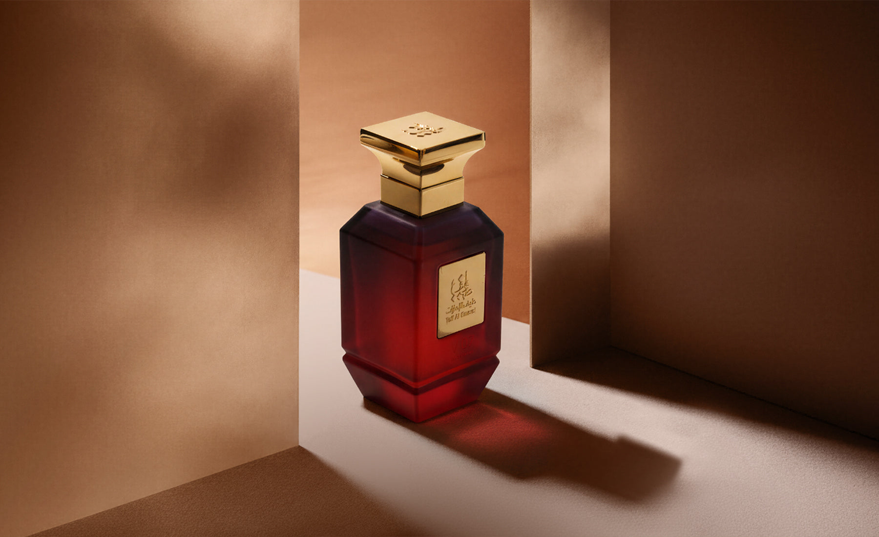 Taif Al Emarat Perfume Bottle With Gold Cap Casting A Soft Shadow - Oud Al Emarat Perfume, Dubai UAE
