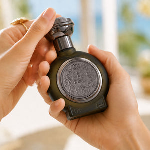 Hand holding TAIF 12 unisex perfume bottle 75ml, top luxury fragrances