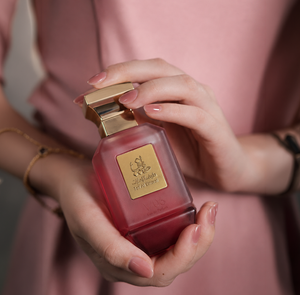 woman hands holding V06 women's perfume bottle 75ml - best selling women's perfume in uae