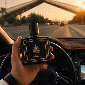 Hand holding Al Yamani perfume bottle 80ml inside moving car - powerful musk and amber perfume
