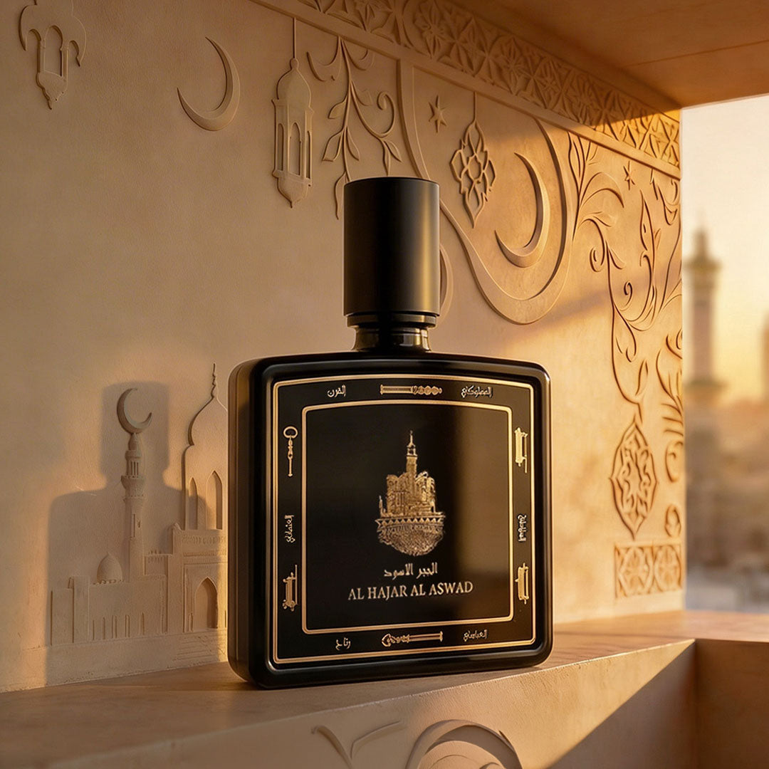 Al Hajar Al Aswad perfume bottle 80ml from taif al emarat perfumes resting on a marble with Islamic portraits - fine oud fragrance