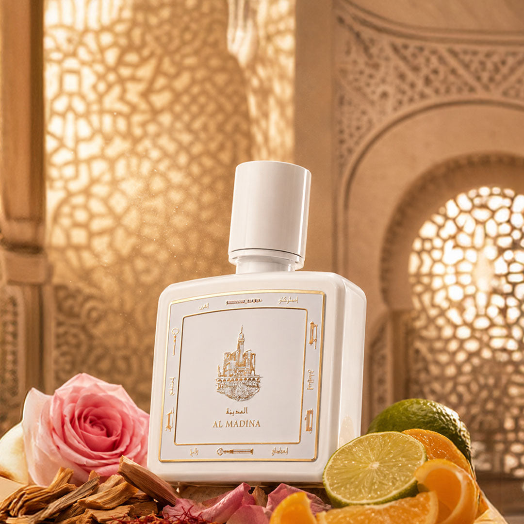 Al Madina perfume bottle 80ml surrounded by bergamot, oud and rose - luxurious madina fragrance