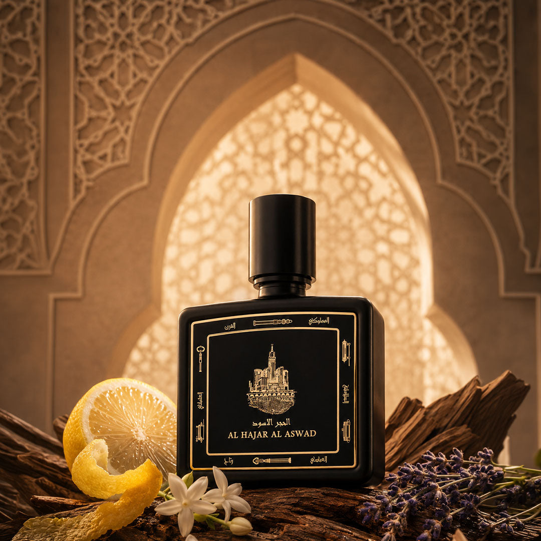 Al Hajar Al Aswad perfume bottle 80ml surrounded by lemon, lavender and oud  - fine oud fragrance