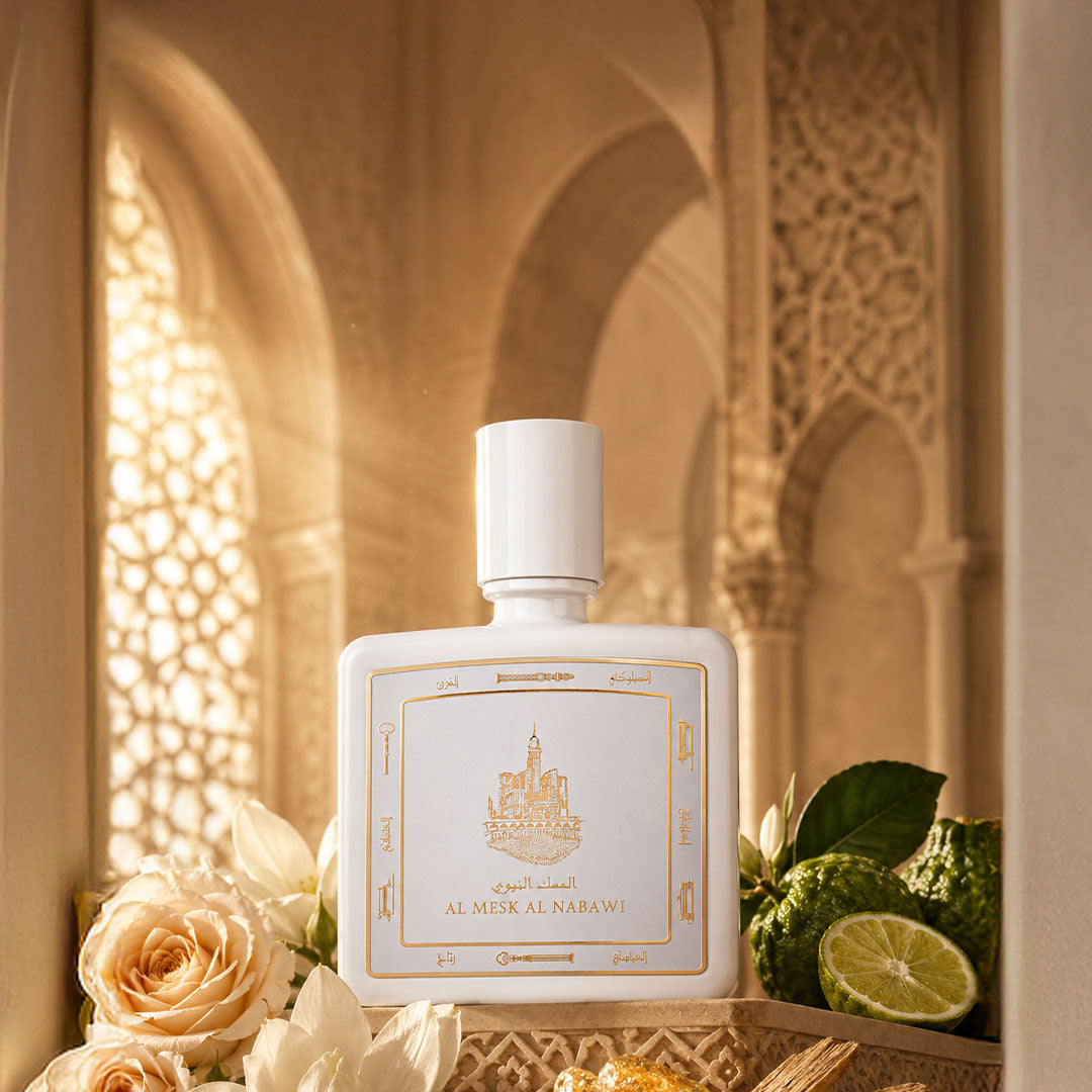 Al Mesk Al Nabawi perfume bottle 80ml surrounded by mandarin, amber and magnolia  - a rich rose musk perfume