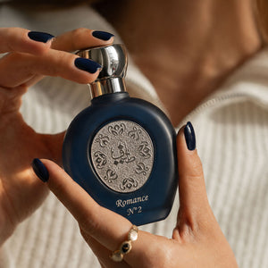 woman hands holding ROMANCE N°2 women's perfume bottle 75ml from taif al emarat perfumes - top latest fragrance for women