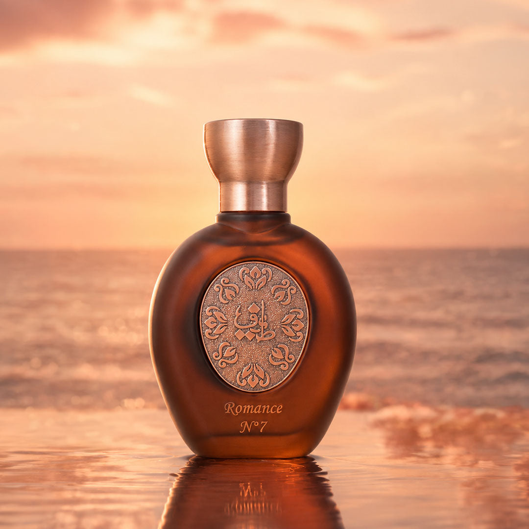 ROMANCE N°7 women's perfume bottle 75ml from taif al emarat perfumes,  standing on wet sand - fragrant musk and amber perfume
